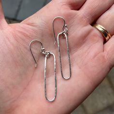 Do you need a gift for someone special? These classic oval earrings go with everything and should be a staple in your jewelry wardrobe! Here are the details: This pair of earrings is 100% handcrafted by me out of sterling silver wire. . . and the long oval measures about 1 1/2" and is hammered for texture. Minimalist Sterling Silver Oblong Earrings, Silver Paperclip Everyday Earrings, Silver Oval Earrings For Everyday, Silver Oval Minimalist Earrings, Minimalist Silver Oval Earrings, Dainty Oval Earrings For Everyday, Sterling Silver Oblong Earrings For Gift, Oval Jewelry With French Hook For Gifts, Sterling Silver Paperclip Earrings As Gift