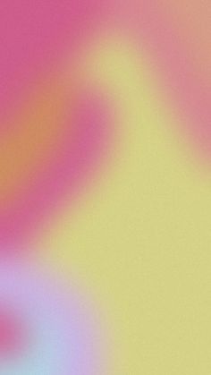 a blurry image of pink and yellow colors