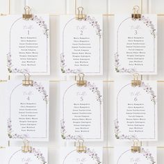 wedding seating cards with purple flowers and gold numbers on white card stock, set of 12