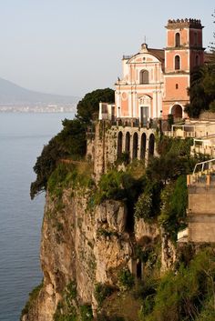 an old church perched on the edge of a cliff