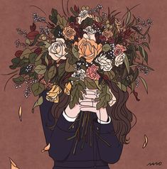 a woman holding a bouquet of flowers over her face