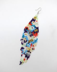 Amazing colors combined in a Modern Powwow Native American Style Seed Bead Earring set. Great new BOHO design with great colors and styling. Stainless steel ear wires and genuine high quality beads. A beautiful combination of colors and native design at a super price. All handmade. Shipped Free Adjustable Multicolor Beaded Earrings With Ear Wire, Multicolor Single Beaded Earring For Festival, Multicolor Beaded Single Earring For Festival, Native Design, Handmade Earrings Beaded, Design Seeds, Native American Fashion, Boho Designs, Seed Bead Earrings