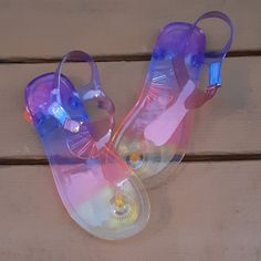 New! These Jellies Are Beautiful! They Have An Ombre Effect Starting With Yellow And Ending In Purple. Velcro Strap Makes Them Easy To Put On And Take Off! Grab Them Today! Casual Plastic Sandals For Playtime, Plastic Sandals For Playtime In Summer, Fun Flat Jelly Sandals For The Beach, Fun Flat Jelly Sandals For Beach, Playful Jelly Sandals For Summer Vacation, Playful Jelly Sandals For Beach In Summer, Fun Summer Sandals For Playtime, Playful Adjustable Jelly Sandals For Summer, Adjustable Playful Jelly Sandals For Summer