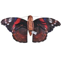 a red and black butterfly with white spots on it's wings