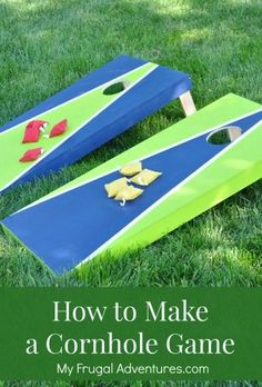 two blue and green cornhole boards sitting in the grass