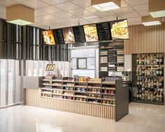 the inside of a fast food restaurant with menus on the wall