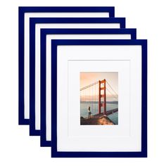 four framed photos of the golden gate bridge