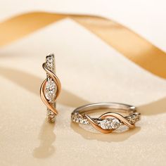 As a couple in love, you are also best friends. Holidays, birthdays, anniversaries, and other special occasions become a celebration of your enduring love and friendship. The beautiful two tone design meaningfully represents the dual nature of your bond. Smaller stones above and below the center stones and a graceful swirling ribbon of polished rose gold tone complete the lovely linear look.Carat Weight: 1.7 ctStone Size: 2.5,1.5 mmNumber of Stones: 20 Stone Shape: RoundStone Color: Diamond Whit A Couple In Love, Twisted Hoop Earrings, Couple In Love, Love And Friendship, Online Earrings, Quality Jewelry, Two Tone, Gold Earrings, Gold Tones