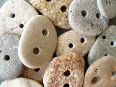 several different colored rocks with holes in them