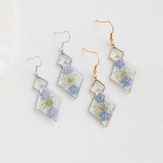 Forget Me Not Flower Earrings for Women | Handmade Real Flower Earrings | Dangle Drop Earrings | Birthday Gift for Her | Christmas Gift 🌿These Forget Me Not Flower Earrings are a stunning work of art that combines the beauty of nature with elegant craftsmanship. Handmade with real Forget Me Not flowers delicately preserved in a crystal-clear resin, these earrings are a unique and personalized gift for any flower lover.  🌿The vibrant blue color of the Forget Me Not flowers is beautifully captur Mother's Day Dangle Earrings With Flower Charm, Dangle Flower Earrings As Gift, Dangle Flower Earrings With Ear Wire As A Gift, Silver Flower Crystal Earrings For Gift, Dangle Flower Earrings With Ear Wire For Mother's Day, Silver Flower Shaped Crystal Earrings For Gift, Hypoallergenic Flower Dangle Earrings For Anniversary, Hypoallergenic Dangle Flower Earrings For Anniversary, Birthday Drop Earrings