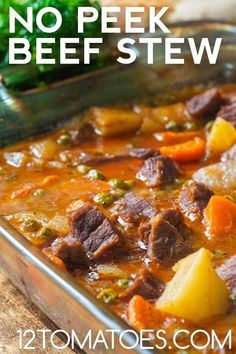 a metal pan filled with stew and vegetables