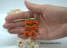 "Stylish earrings for Halloween, Seed bead pumpkin earrings These pumpkin earrings for Halloween are specially made for you to emphasize your style for the holiday. They emphasize your style and help you stand out from everyone else. This earrings is made from the high-quality Czech bead, with the use of sterling silver furnice, with a bright pumkin pattern. This pumpkin earrings can carry every girls and woman of any age, harmonizes with any clothes. Earrings details: Length: Dangle earrings me Halloween Beaded Dangle Earrings Gift, Halloween Gift Beaded Dangle Earrings, Halloween Seed Bead, Bead Pumpkin, Witch Pumpkin, Blue Polish, Faceted Ring, Earrings Halloween, Stylish Earrings