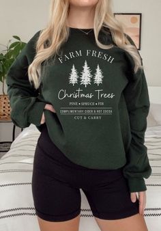 This FARM FRESH CHRISTMAS TREES sweatshirt is super soft and comfy! They go great with leggings, styled with your favorite pair of jeans or just perfect for lounging around at home! Buy one for yourself or for someone as a great gift! Q U I C K  F A C T S  Gildan Unisex Crewneck Sweatshirt 50% cotton, 50% polyester, soft and cozy Our shirts are printed with high quality, non-toxic Direct To Garment Digital Ink for beautiful and natural looking result   C A R E  I N S T R U C T I O N S Wash shirt Farm Fresh Christmas Trees, Holiday Graphic Tees, Fresh Christmas Trees, Christmas Black, Sweatshirt Outfit, Family Christmas Shirts, Women Christmas