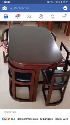 a wooden table with chairs around it in the middle of a tiled floored room