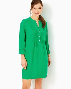 Easy fit, tunic shirtdress with a stand collar, half placket with a front pintuck detail, side slits, and pockets. 36" from top of shoulder to hem (based on a size small/4). Skims the body. Roomier fit. Enjoy extra hem flexibility with this style. Wear as-is or let it out for some extra length.  Lagoon Linen™ (100% Linen). Machine wash cold, delicate cycle, separately, or dry clean. Imported. An easy and colorful daytime essential, the Rhoda Linen Dress is embellished with a stand collar and pintuck details, plus practical pockets. Elegant Long Sleeve Green Tunic, Daywear Relaxed Fit Tunic With Split Neck, Relaxed Fit Split Neck Tunic For Daywear, Casual Buttoned Tunic For Work, Spring Workwear Tunic With Buttons, Spring Tunic For Workwear, Elegant Tunic With Buttons, Spring Button-up Tunic For Workwear, Elegant Shift Shirt Dress For Daywear