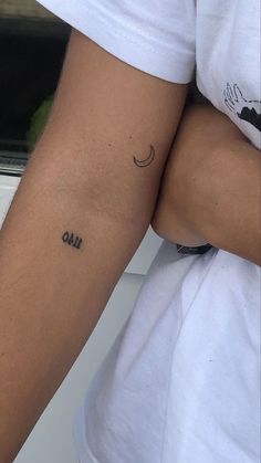 a person with a small tattoo on their arm