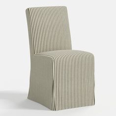 an upholstered chair with a striped cover on the seat and back, in front of a white background