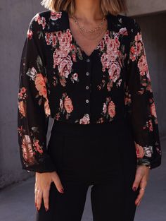 Effortlessly elevate your everyday look with our Flawless Florals Top. Featuring a beautiful floral print, button down design, and comfortable long sleeves, this top is perfect for any occasion. Add a touch of elegance to your wardrobe with this must-have piece. Fabric 100% polyester Feminine Floral Print Button-up Blouse, Chic Floral Print Button-up Blouse, Spring Floral Print Tops For Date Night, Floral Print Tops For Date Night In Spring, Chic Fitted Rose Print Blouse, Black Long Sleeve Top With Rose Print, Chic Fitted Blouse With Rose Print, Fall Date Night Top With Floral Print, Chic Floral Print Long Sleeve Blouse