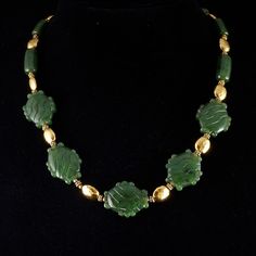 "Beautiful top quality nephrite jade \"stone\" glyph beads strung with golden vermeil beads (24k gold on sterling silver) with a hammered finish.  You will not find an item like this .. of this quality .. for this price .. anywhere! 20\" with vermeil s hook clasp ... this stunning necklace comes in a plush jaguar print drawstring bag. The Maya and Aztec considered green a sacred color, they attached special value to green things ... even small slivers of jade were polished and perforated for suspension, and large pieces were carved in the shape of human faces, animals, or... shaped like a hand. This item comes from my Maya and Aztec inspired line of unique jade jewelry: http://www.michaelgoard.com/jade.htm" Aztec Stone, Jaguar Print, Green Things, Nephrite Jade, S Hook, Green A, Jade Jewelry, Jade Stone, Hook Clasp