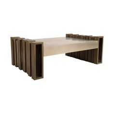 a table made out of wooden slats on top of white paper and brown paint