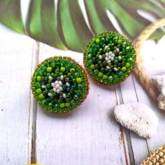 These bead embroidery green kiwi earrings studs would make a perfect and unique gift for family, friend, or yourself. ★DIMENSIONS: 2.5*2.5 cm (0.98*0.98 Inches) ★READY TO SHIP Made with love and care about you!♥ ★The colors can slightly differ from the photo because of photography lighting and monitor settings. ★ESTIMATED SHIPPING TIMES: North America: 2-4 weeks Europe: 1-3 weeks Australia, New Zealand and Oceania: 3-5 weeks Asia Pacific: 2-4 weeks Latin America and the Caribbean: 3-5 weeks North Africa and the Middle East: 3-5 weeks Sub-Saharan Africa: 3-5 weeks ★PLEASE NOTE: I accept payments through Paypal * you no need to have an account* by credit or debit card. 1. Click Check out with PayPal and you'll be redirected to PayPal. Instead of choosing to pay with your PayPal account, sele Handmade Green Round Clip-on Earrings, Green Round Beaded Earrings As Gift, Green Round Beaded Earrings For Gift, Round Green Beaded Earrings As Gift, Handmade Green Clip-on Earrings As Gift, Green Round Clip-on Earrings As Gift, Green Round Clip-on Earrings For Gift, Kiwi Earrings, Kiwi Slice