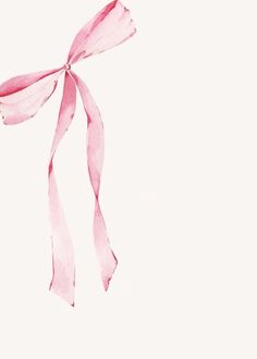 a pink ribbon tied to a white wall