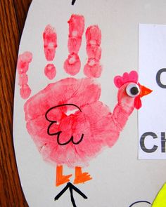 a child's handprint on a paper plate with the word chick written in it