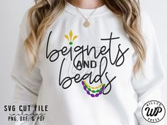 a woman wearing a white sweatshirt with the words, benefits and beads on it's chest