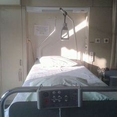 the hospital bed is empty and ready for someone to use it as a medical device