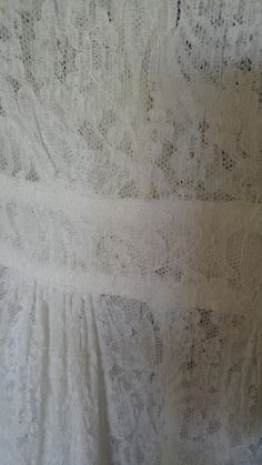 "20's Absolutely stunning lace maxi 'duster' style dress / night gown. Super pretty frilled collar with white ribbon tie at the front. The dress is open to the waist which has tiny fabric covered buttons and loops (one button covering missing) The dress is open down the middle of the skirt from waist to hem. Romantic sleeves 3/4 style with large frilly cuffs at elbows. Dress / night gown in such beautiful condition! Bust across 27\", waist when buttoned up 22\", sleeves 18 1/2\", dress length 53 Lace Maxi Dress For Wedding Night, Formal Summer Maxi Dress With Lace Trim, Summer Formal Maxi Dress With Lace Trim, Lace Wedding Night Dress With Lace Trim, Lace Empire Waist Dress With Lace Trim, Elegant Lace Dress With Lace Collar For Daywear, Feminine Lace Maxi Dress For Daywear, Spring Daywear Lace Dress With Delicate Lace, Daywear Dress With Lace Bodice And Empire Waist