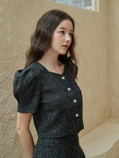 This is a trendy and feminine blouse by bibyseob that is made out of high quality and sturdy material. With distinctive mood of the design and modern feminine look, you can style it for your casual daily outfit.- Feminine mood and high quality fabric- Set up with matching skirt- Unique button closure on the front- Puffy short sleeves Black Office Lady Blouse For Fall, Black Office Blouse For Fall, Elegant Tweed Tops For Fall, Trendy Black Blouse For Office Wear, Black Office Lady Top For Workwear, Chic Tweed Tops For Fall, Tweed Blouse, Outfit Feminine, Feminine Blouses