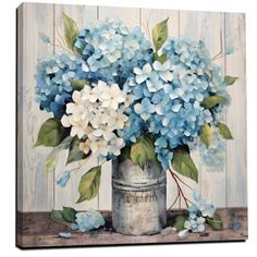 a painting of blue and white flowers in a tin can on a wooden table top