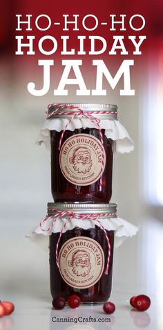 two jars filled with jam sitting on top of a table