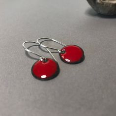 Pretty lightweight minimalistic red dot earrings. Handmade from hand cut copper disk and red glass enamel. Lightweight Disk Diameter is: 3/8 inch diameter 1 1/8 inch drop length (approximately) DONT WANT RED? contact seller for other color options. Blues, greens, yellows, pinks, purples, grays, browns, black... Dot Earrings, Complimentary Colors, Enamel Earrings, Red Dots, Red Glass, Minimalist Earrings, Minimalist Jewelry, Ear Wires, Earrings Handmade