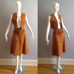 Vintage 1970s Brown Suede Cropped Vest And Chevron Striped Skirt Very Boho Hippie Vest Is Slightly Cropped With No Openings Button Front A Line Skirt Only Tag Is On Skirt Overall Good Vintage Condition Age Appropriate Minor Wear Tag Reads: US 11/12  Canada 13/14 Best Fit Approximately A Modern Small - M Please Refer To Measurements To Ensure Best Fit Lying Flat, In Inches Vest Shoulders: 15 Underarms: 17 Total Length: 17 Skirt Waist: 14 Hips: 21 Length: 28 Fitted Vintage Skirt For Fall, Fitted Vintage Mini Skirt, Vintage Skirt For Fall, Fitted Vintage Skirt For Vintage Fashion, Vintage Fitted Pleated Skirt, Vest Festival Outfit, Suede Vest Outfit, Modern Hippie Outfits, Outfit References