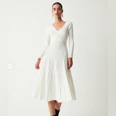 Brand New Dress, Never Worn. Pleated Knit Style Is Very Flattering And It’s A Comfortable Stretchy Dress. White V-neck Sweater Dress For Fall, Casual White V-neck Dress For Fall, Elegant White Knit Midi Dress, Chic White V-neck Sweater Dress, Elegant Ribbed Midi Dress With V-neck, Elegant White Sweater Dress For Workwear, Elegant Ribbed V-neck Midi Dress, Elegant White Sweater Dress For Work, Elegant V-neck Ribbed Midi Dress