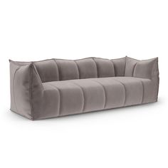 a gray velvet sofa on a white background with the back turned to look like it's made out of fabric