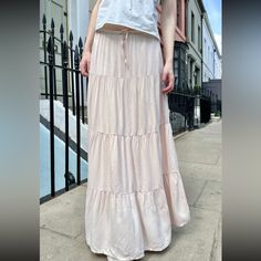 Long, Flowy, Prairie Skirt With A Tie Waist And Ruffle Seams. Fabrics: Shell 100% Viscose, Lining 100% Cotton Measurements: 36" (91 Cm) Length, 28" (71 Cm) Waist (Stretches) Made In: China Vacation Tiered Rayon Skirt, Flowy Tiered Viscose Skirt, Rayon Tiered Maxi Skirt For Day Out, Chic Viscose Tiered Maxi Skirt, Chic Tiered Viscose Maxi Skirt, Spring Tiered Viscose Maxi Skirt, Flowy Tiered Viscose Maxi Skirt, Tiered Rayon Skirt With Lining, Rayon Tiered Lined Skirt