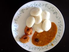 a plate that has some kind of food on it with sauce and marshmallows