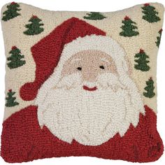 a christmas pillow with a santa clause on it