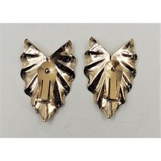 pair of gold tone metal bow clip earrings