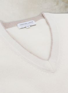 Experience the luxury and warmth of our Melbourne V-Neck Merino Wool Sweater. Crafted from 100% Extra Fine 2-ply Merino Wool yarn from Australia, this sumptuous sweater offers warmth, softness and luxury to every day dressing. Unique details such as the subtle contrast at the neckline bring upscale luxury to a timeless, every-day piece. • 100% Extra Fine Merino Wool • Dry clean or hand wash, dry flat • Imported • Item # WL-2006W-CRM Luxury Merino Wool V-neck Sweater For Work, Luxury Fine Knit Merino Wool Sweater, Classic Merino Wool V-neck Sweater In Fine Knit, Luxury White Merino Wool Sweater, Luxury Fine Knit Merino Wool V-neck Sweater, Merino Wool Yarn, Sweater Collection, Merino Wool Sweater, Wool Yarn