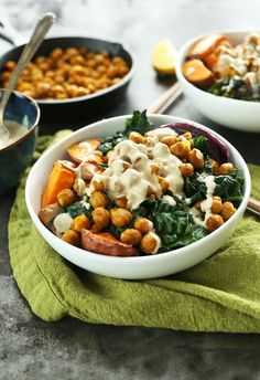 a white bowl filled with food on top of a green cloth