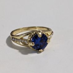 Gorgeous gold-plated Blue Crystal Ring with clear dazzling crystals. size 7 1/2. It shines like real gold. GREAT Gift! No Tarnish It will come in a gift bag Gold Crystal Ring With Bling, Gold Crystal Ring With Rhinestones For Formal Occasions, Gold Crystal Ring With Sparkling Stones, Gold Rhinestone Rings For Anniversary, Gold Crystal Promise Ring With Rhinestones, Gold Rings With Rhinestones For Anniversary, Gold Crystal Ring With Stone Setting For Formal Occasions, Gold Rings With Rhinestones, Gold Crystal Ring With Accent Stones