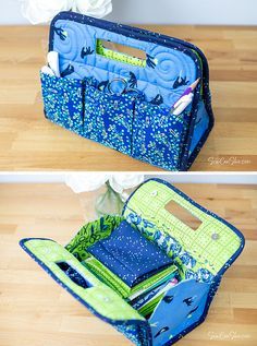 an open blue and green purse sitting on top of a wooden floor