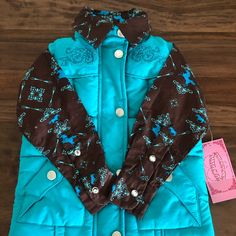 Omg. Pair This With Jeans/Cowboy Boots/Hat... Adorable. New With Tags Size 12m New. Never Ended Up Wearing Turquoise Puffer Jacket. 2 Front Pockets. Horse On Zipper. Nylon/Polyester Brown Shirt Has Diamond Like Buttons And Rhinestones On Top & Horses. 100% Cotton Brand: Cowboy Hardware A Local Az Company Western Style Blue Winter Outerwear, Fitted Blue Western Outerwear, Cute Blue Outerwear For Fall, Turquoise Long Sleeve Outerwear For Winter, Turquoise Long Sleeve Winter Outerwear, Casual Turquoise Winter Outerwear, Fitted Turquoise Outerwear For Winter, Blue Fitted Cute Outerwear, Cute Blue Fitted Outerwear