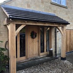 a wooden building with a wreath on the front door