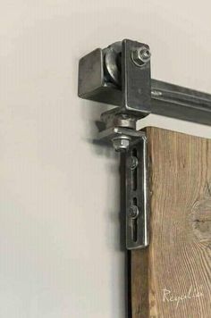 a close up of a wooden door with metal handles