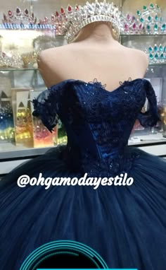 a blue ball gown on display in a store