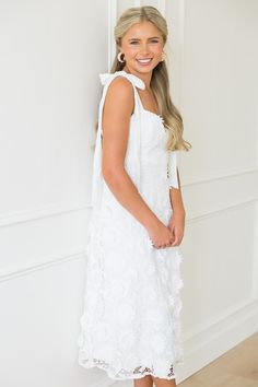 If you're a summer bride, this white midi is a stunning choice for any showers or your rehearsal dinner! The flirty bustier style top is fitted through the waist and falls into an A-line skirt. The ribbon straps are adjustable, and a full liner ensures a smooth, opaque fit.  Fully lined Back zip closure Adjustable tie straps  Fabric content: Shell & Lining- 100% polyester. Contrast- 100% cotton Fabric has no stretch Fit... White Bridesmaid Dress With Bow Straps, White Strapless Tie-back Dress, White Dress With Sweetheart Neckline And Bow Straps, White Dress With Bow Straps And Sweetheart Neckline, White Strapless Dress With Tie Back, Summer Bridal Shower Dress With Sweetheart Neckline, White Dress With Adjustable Straps For Garden Party, White Bridesmaid Dress With Delicate Straps, White Dresses With Bow Straps For Brunch